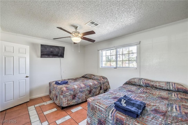 tiled bedroom featuring a textured ceiling, ceiling fan, and crown molding