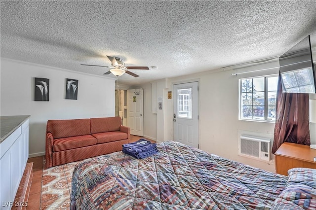 bedroom featuring a wall unit AC and ceiling fan