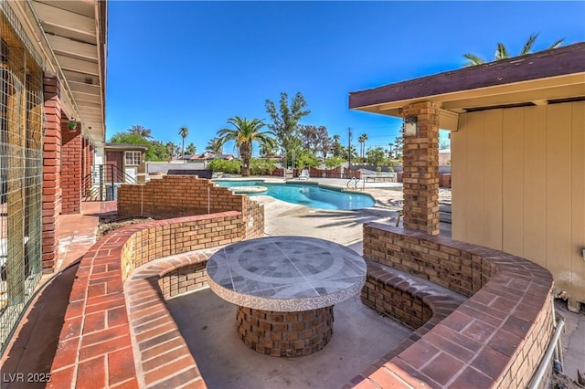 view of patio featuring a fenced in pool