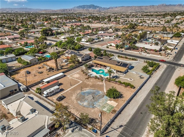 birds eye view of property featuring a mountain view