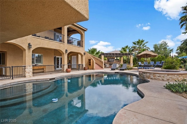 outdoor pool featuring a patio area, an in ground hot tub, and a pergola