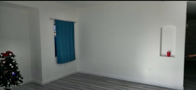 empty room with hardwood / wood-style floors