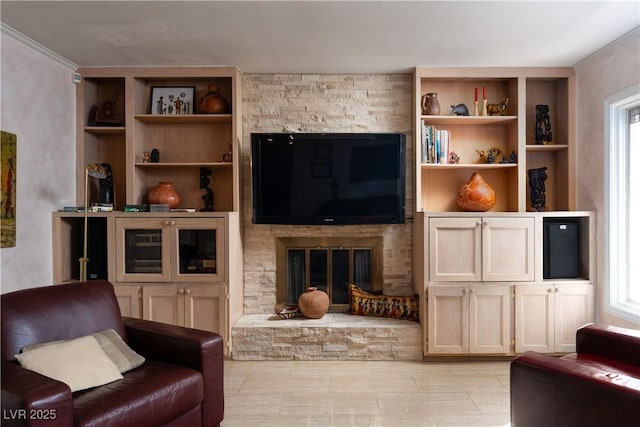 living room with a fireplace and plenty of natural light