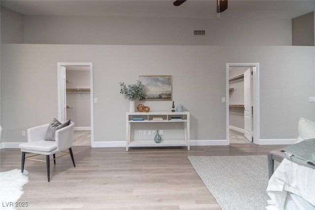 interior space featuring light wood-type flooring and ceiling fan