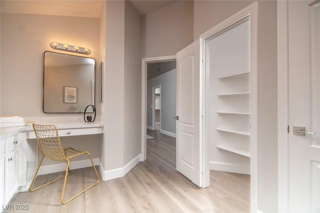 bathroom featuring hardwood / wood-style floors and vanity