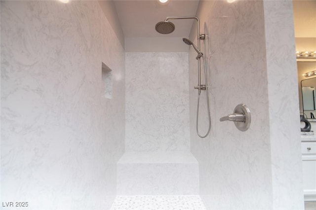 bathroom with tiled shower