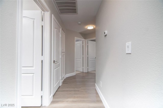 hall featuring light hardwood / wood-style flooring