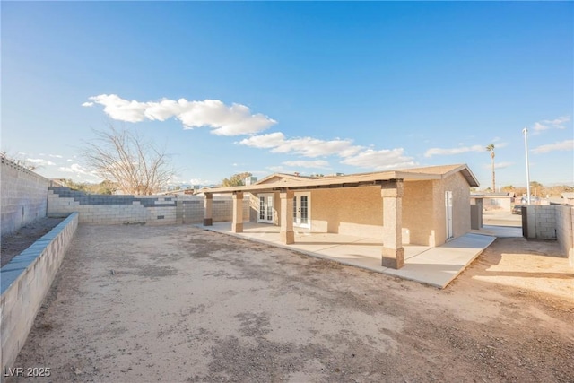 back of property with a patio area