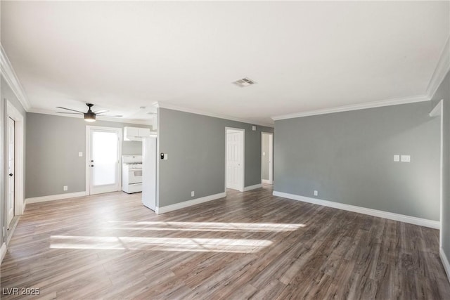 empty room featuring hardwood / wood-style floors, ceiling fan, and ornamental molding