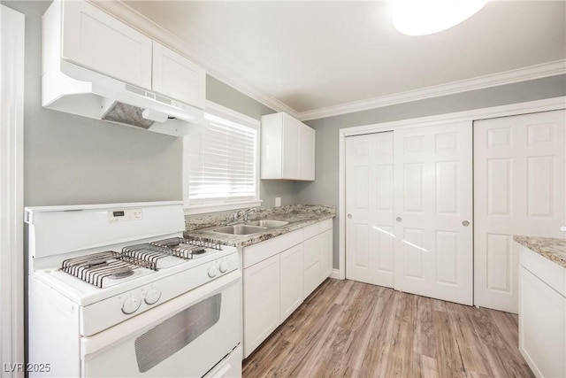 kitchen featuring ornamental molding, sink, white range with gas stovetop, light hardwood / wood-style floors, and white cabinetry