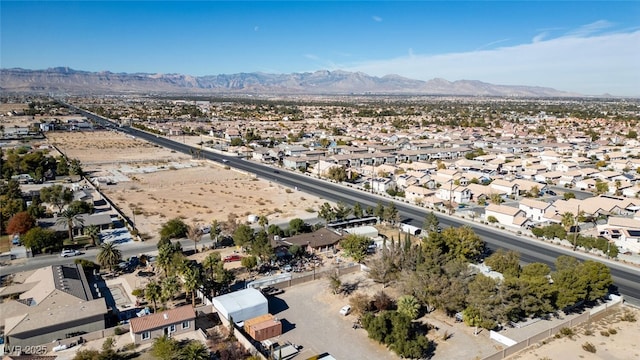 birds eye view of property featuring a mountain view