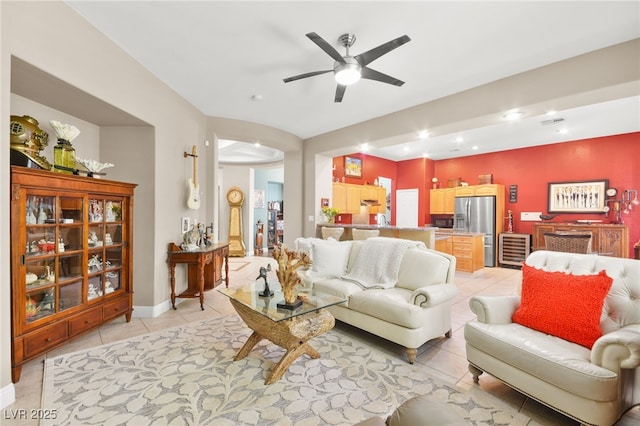 living room featuring light tile patterned floors, wine cooler, and ceiling fan