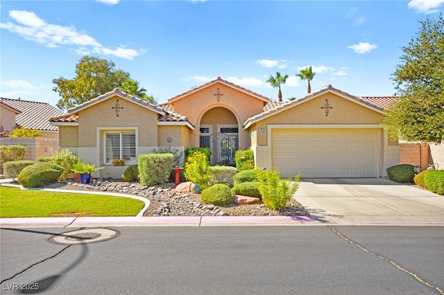 mediterranean / spanish-style house featuring a garage