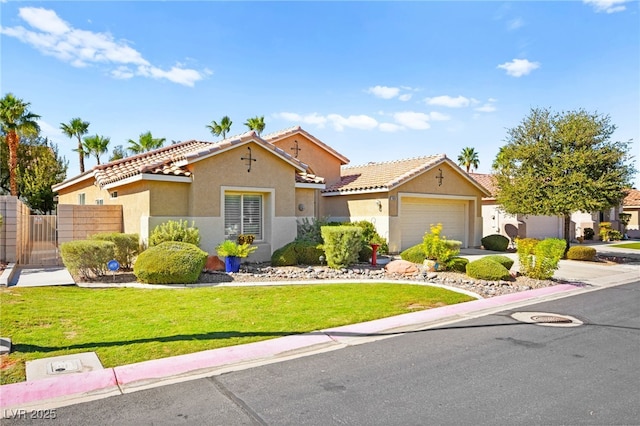 view of front of home featuring a garage and a front lawn