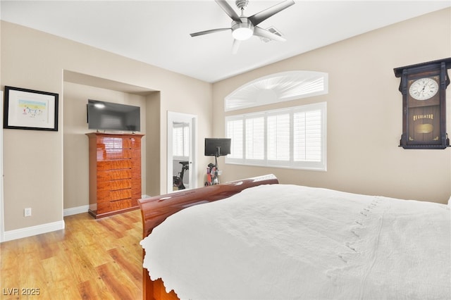 bedroom with ceiling fan and light wood-type flooring