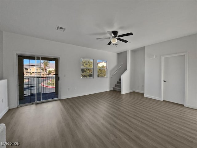 unfurnished living room featuring hardwood / wood-style floors and ceiling fan