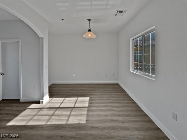 unfurnished dining area with dark hardwood / wood-style floors