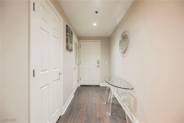 corridor with dark hardwood / wood-style floors