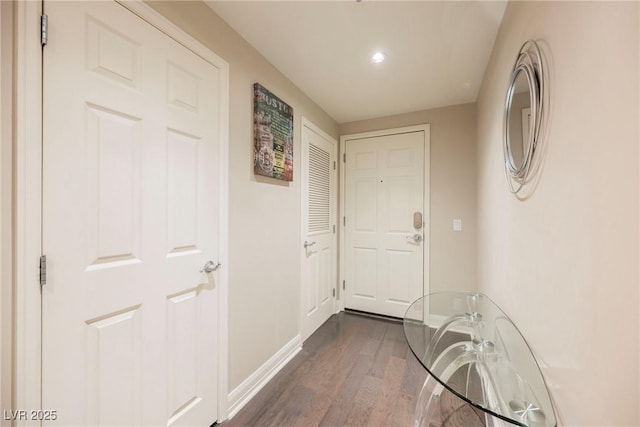 corridor featuring dark hardwood / wood-style flooring