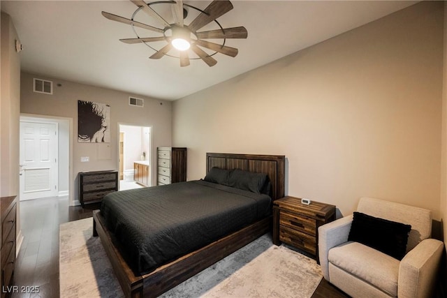 bedroom with ceiling fan, dark hardwood / wood-style floors, and ensuite bathroom