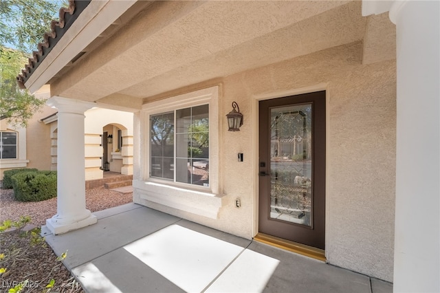 entrance to property featuring a porch