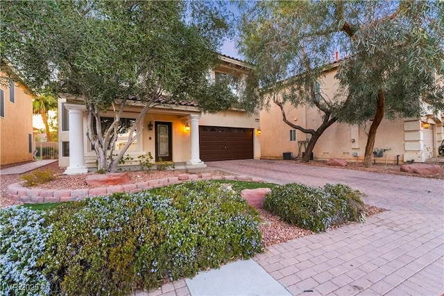 mediterranean / spanish-style home featuring a garage