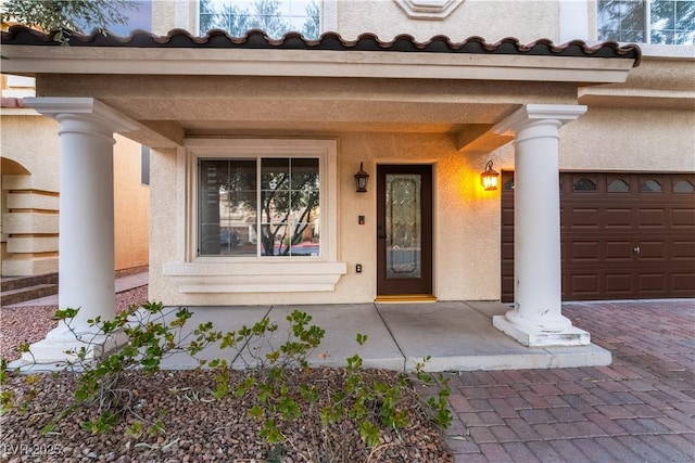 doorway to property featuring a garage