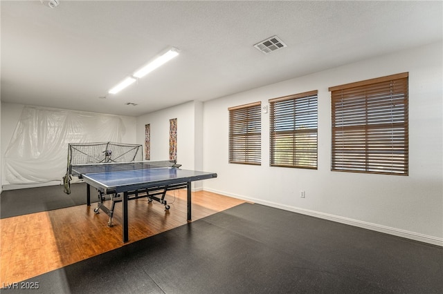 game room with hardwood / wood-style floors