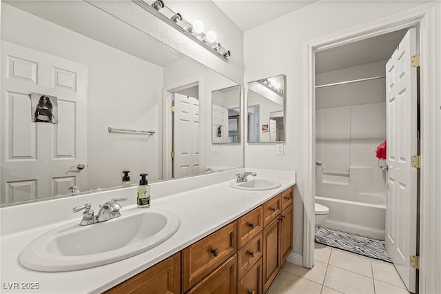 full bathroom with tile patterned flooring, vanity, bathing tub / shower combination, and toilet