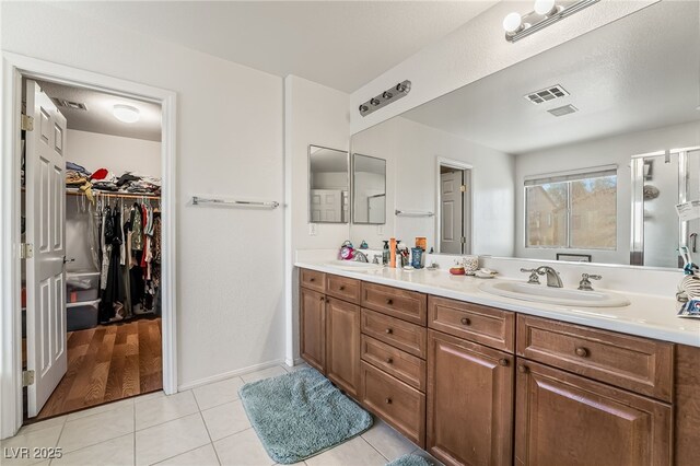 bathroom featuring vanity and tile patterned flooring