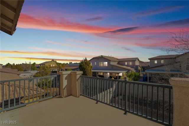 view of balcony at dusk