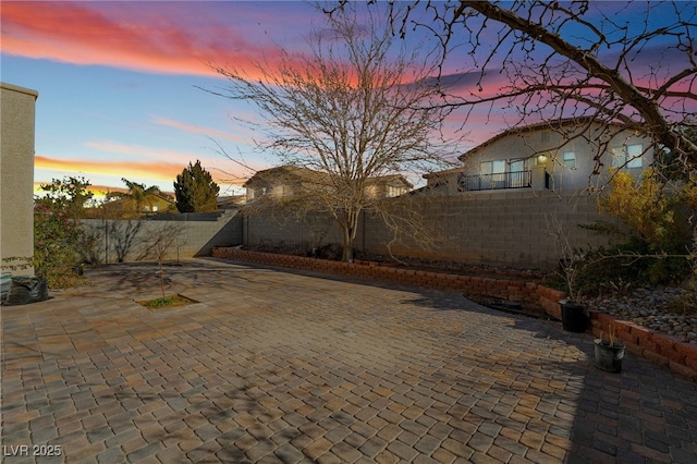 view of patio terrace at dusk