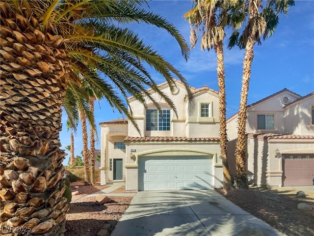 mediterranean / spanish-style house featuring a garage