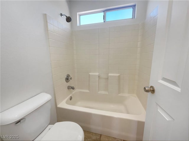 bathroom with toilet and washtub / shower combination