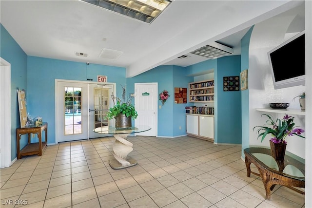 interior space featuring french doors and light tile patterned floors