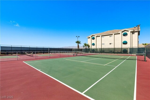 view of tennis court featuring basketball court