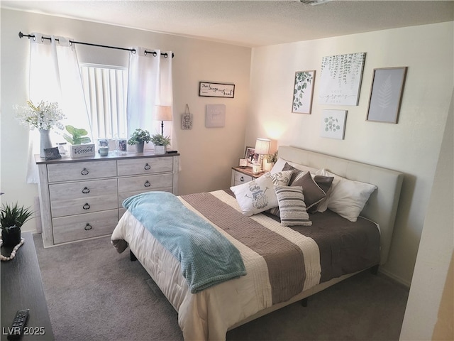 bedroom featuring dark colored carpet