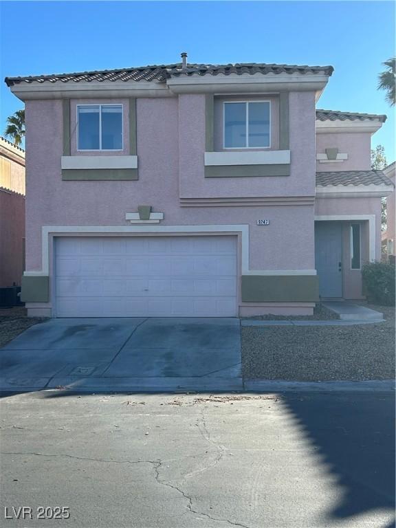 front of property with a garage