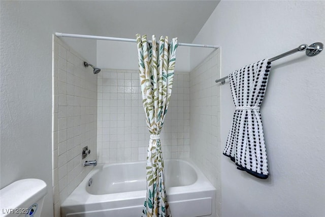 bathroom with toilet and shower / tub combo with curtain