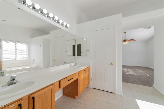 bathroom with vanity, a tub to relax in, tile patterned floors, and ceiling fan