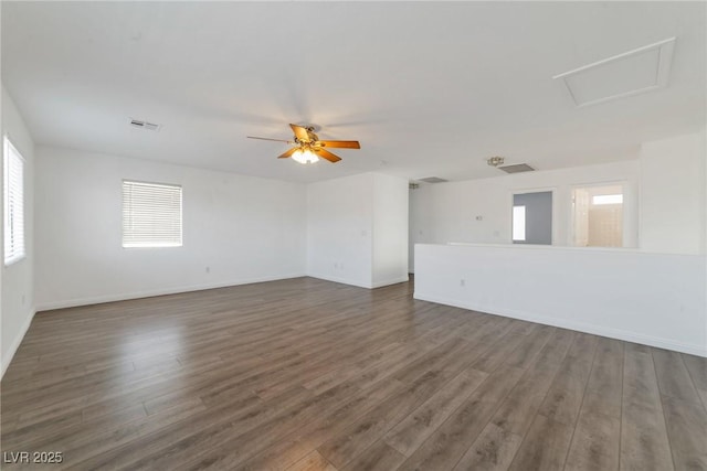 empty room featuring dark hardwood / wood-style flooring and ceiling fan