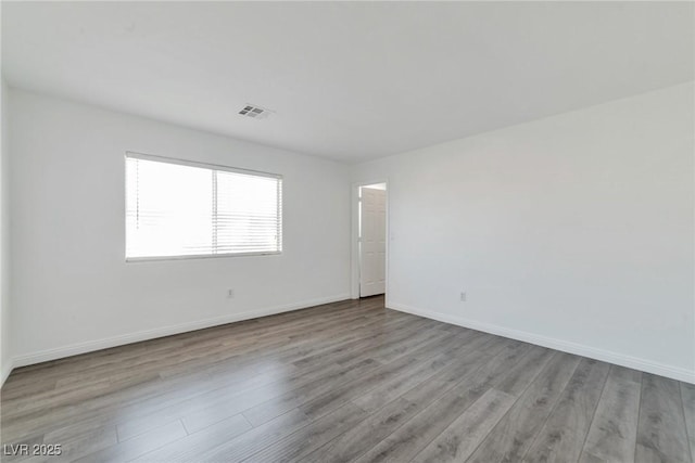 unfurnished room with light hardwood / wood-style flooring