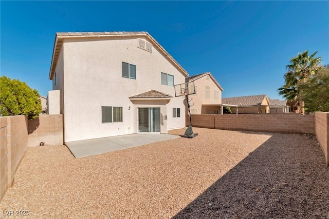 back of property featuring a patio