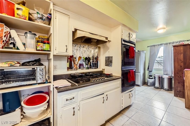 kitchen featuring open shelves, stainless steel appliances, under cabinet range hood, white cabinetry, and dark countertops