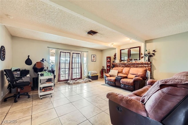 living room featuring light tile patterned floors, visible vents, french doors, and a textured ceiling