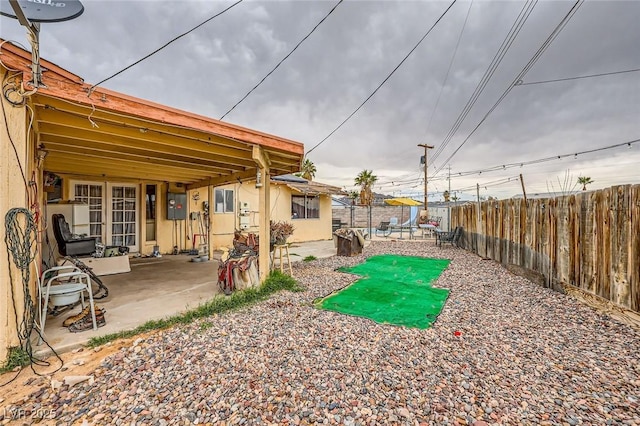 view of yard with a patio and a fenced backyard