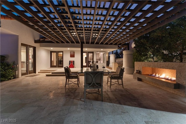 view of patio / terrace featuring a pergola and an outdoor fireplace