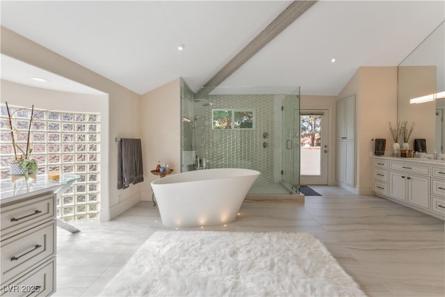 bathroom with plus walk in shower, vanity, and lofted ceiling with beams