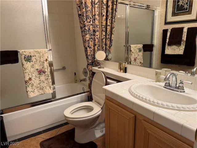 full bathroom with shower / bath combination with glass door, vanity, tile patterned floors, and toilet