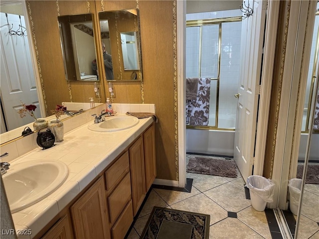 bathroom featuring shower / bath combination with glass door, tile patterned floors, and vanity